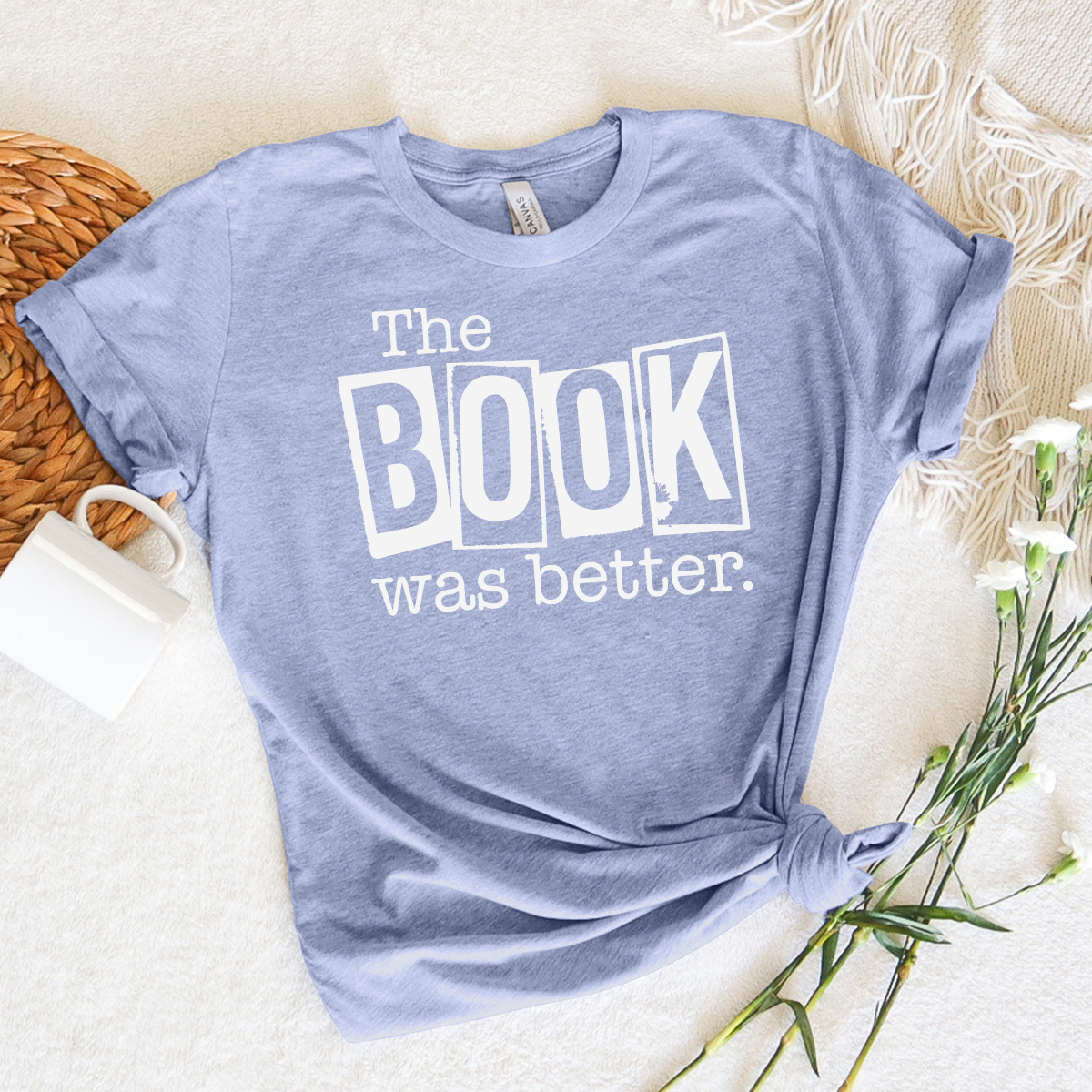 book was better unisex tee