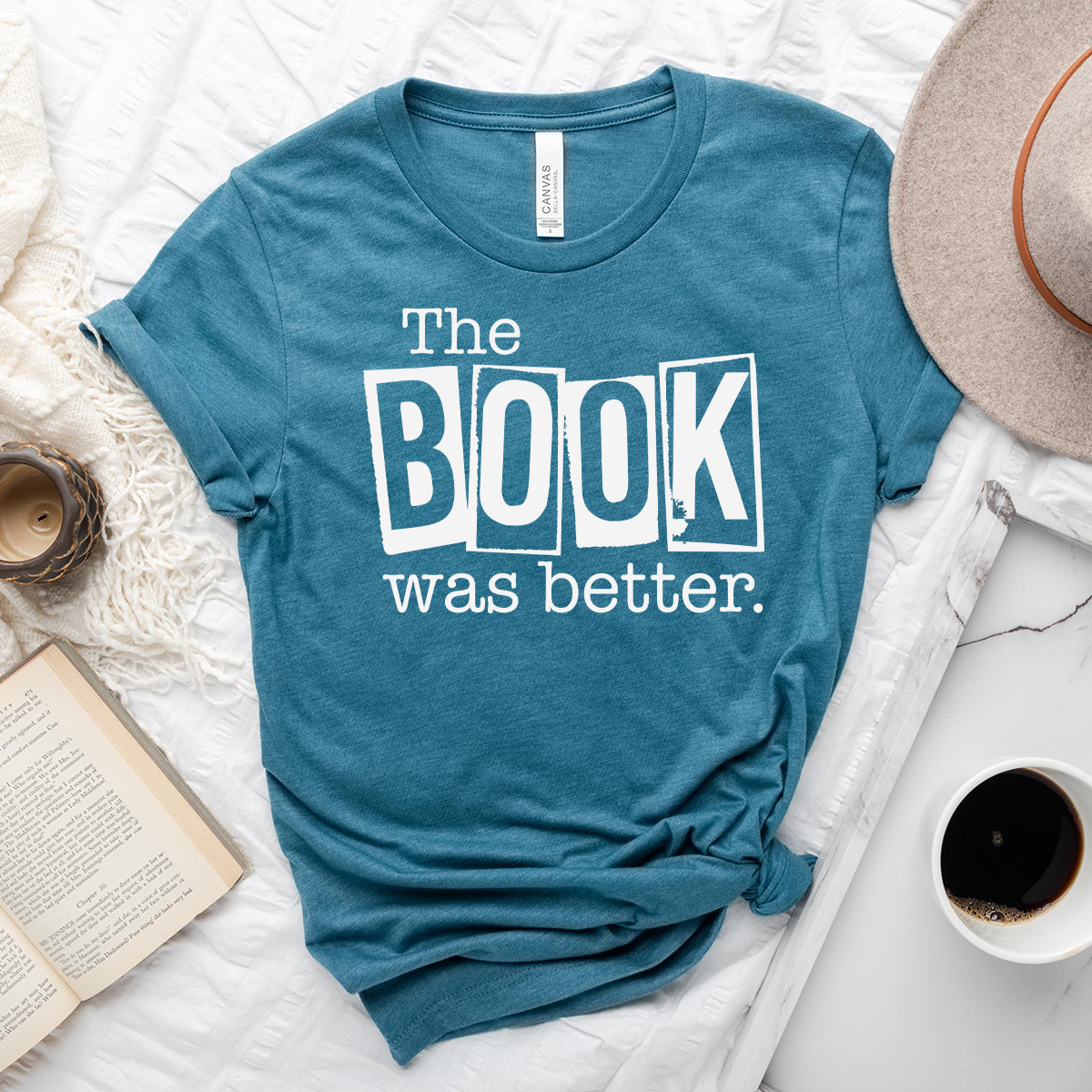 book was better unisex tee