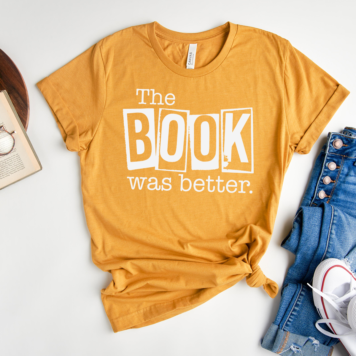 book was better unisex tee